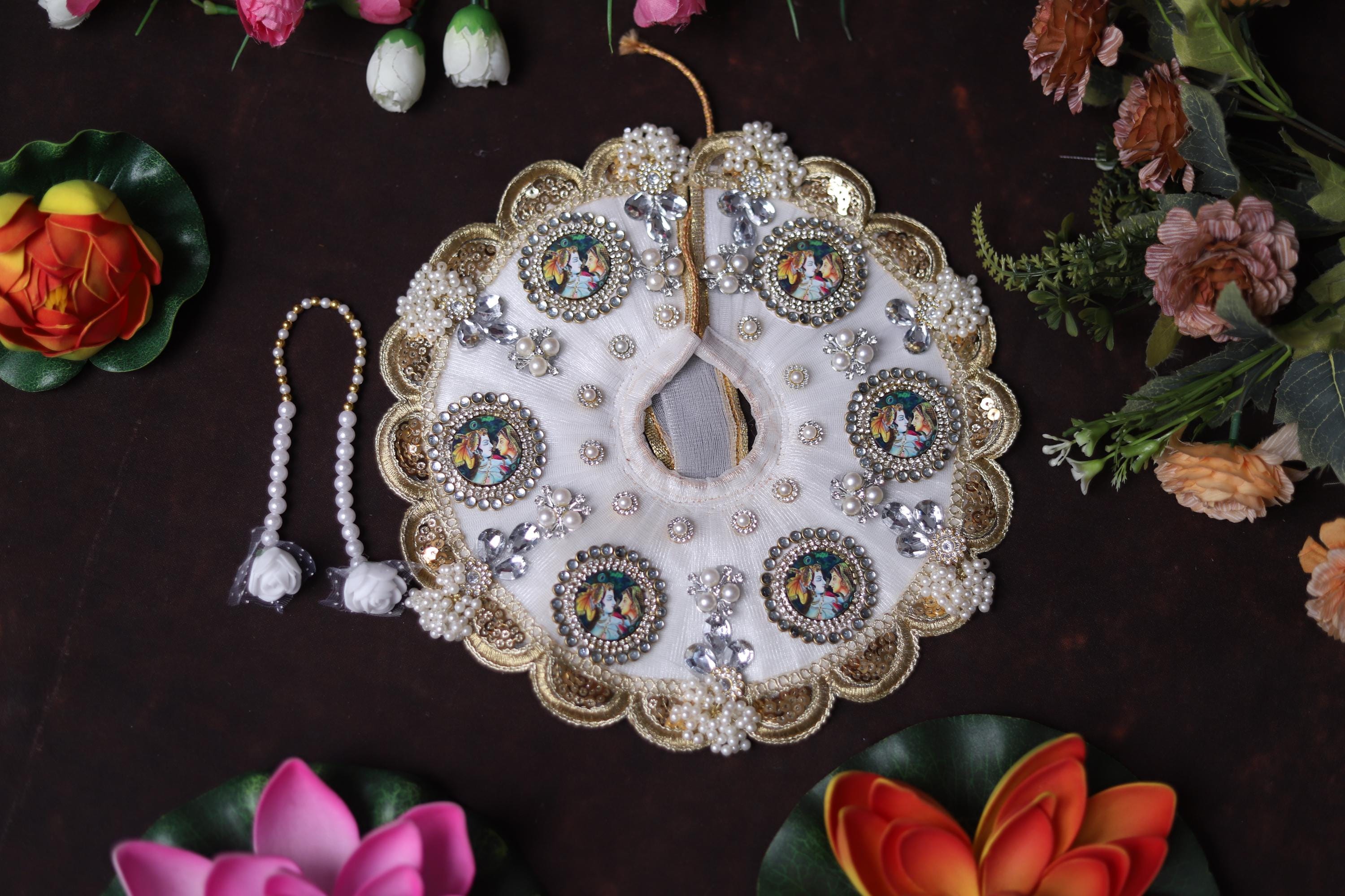 White Shrinathji Embroidered Laddu Gopal Dress with Elegant Golden Ruffled Lace Border Janmashtami and Festive Puja Wear