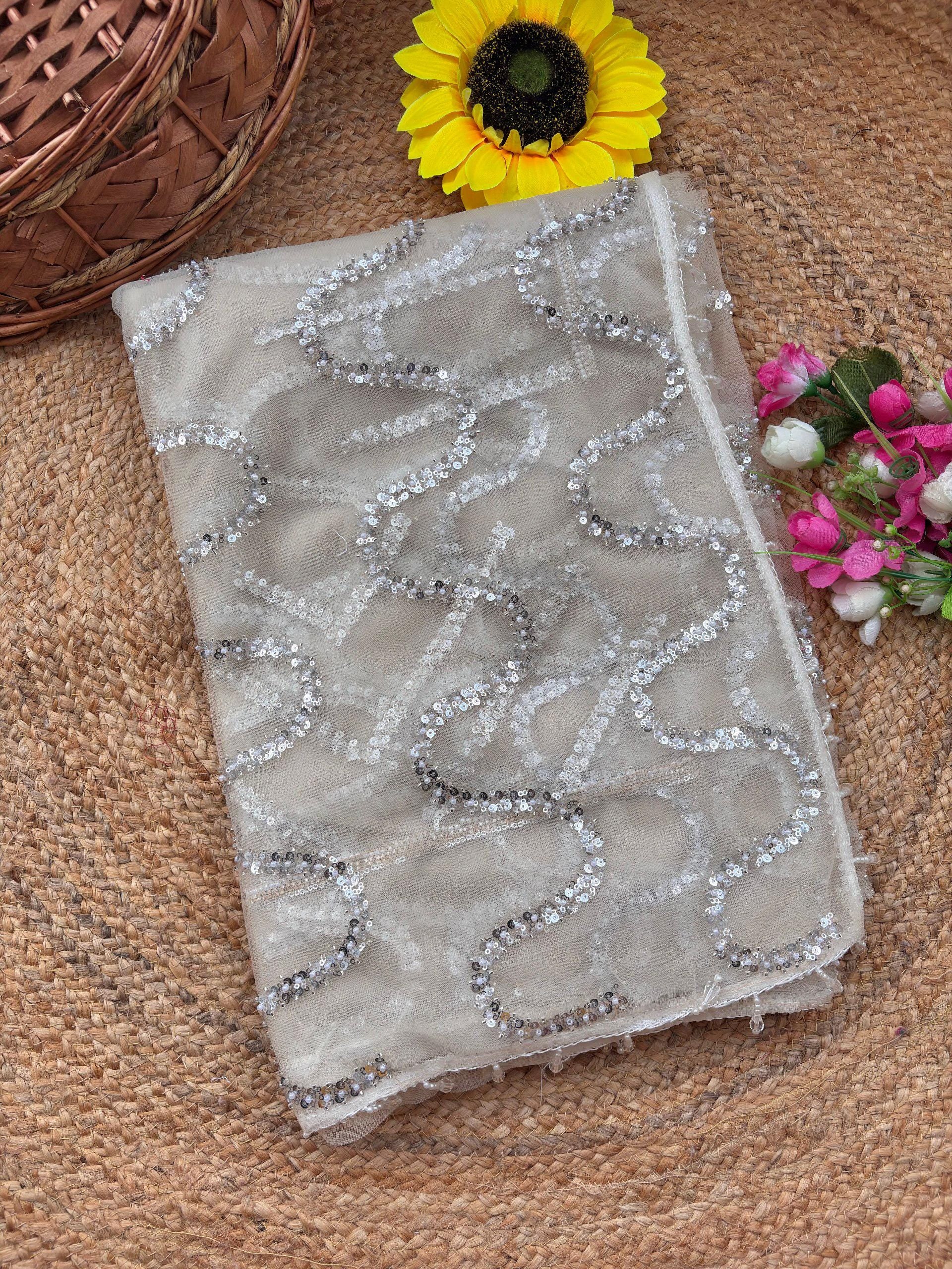 White Soft Net Saree with Beadwork & Cutwork Border