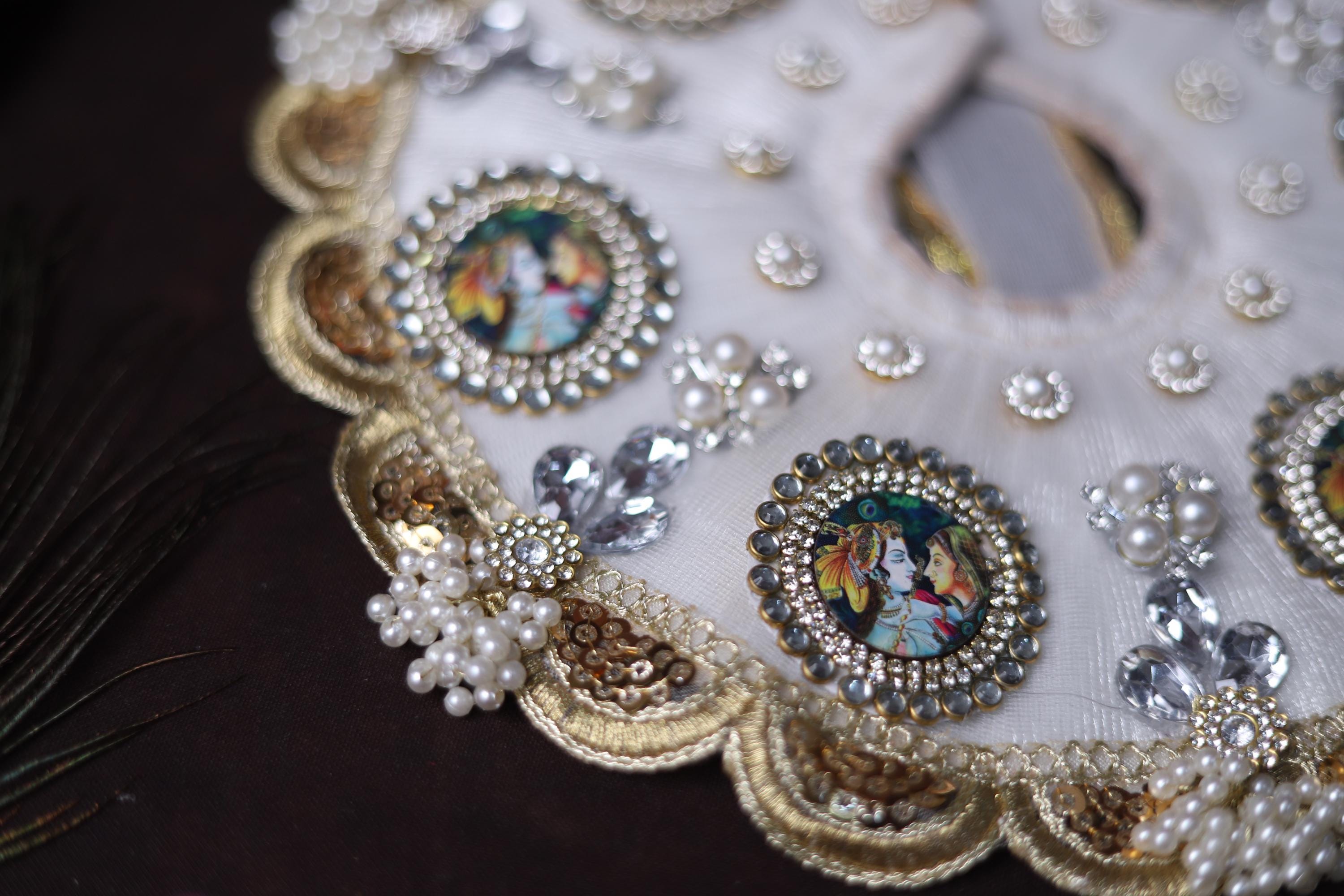 White Shrinathji Embroidered Laddu Gopal Dress with Elegant Golden Ruffled Lace Border Janmashtami and Festive Puja Wear