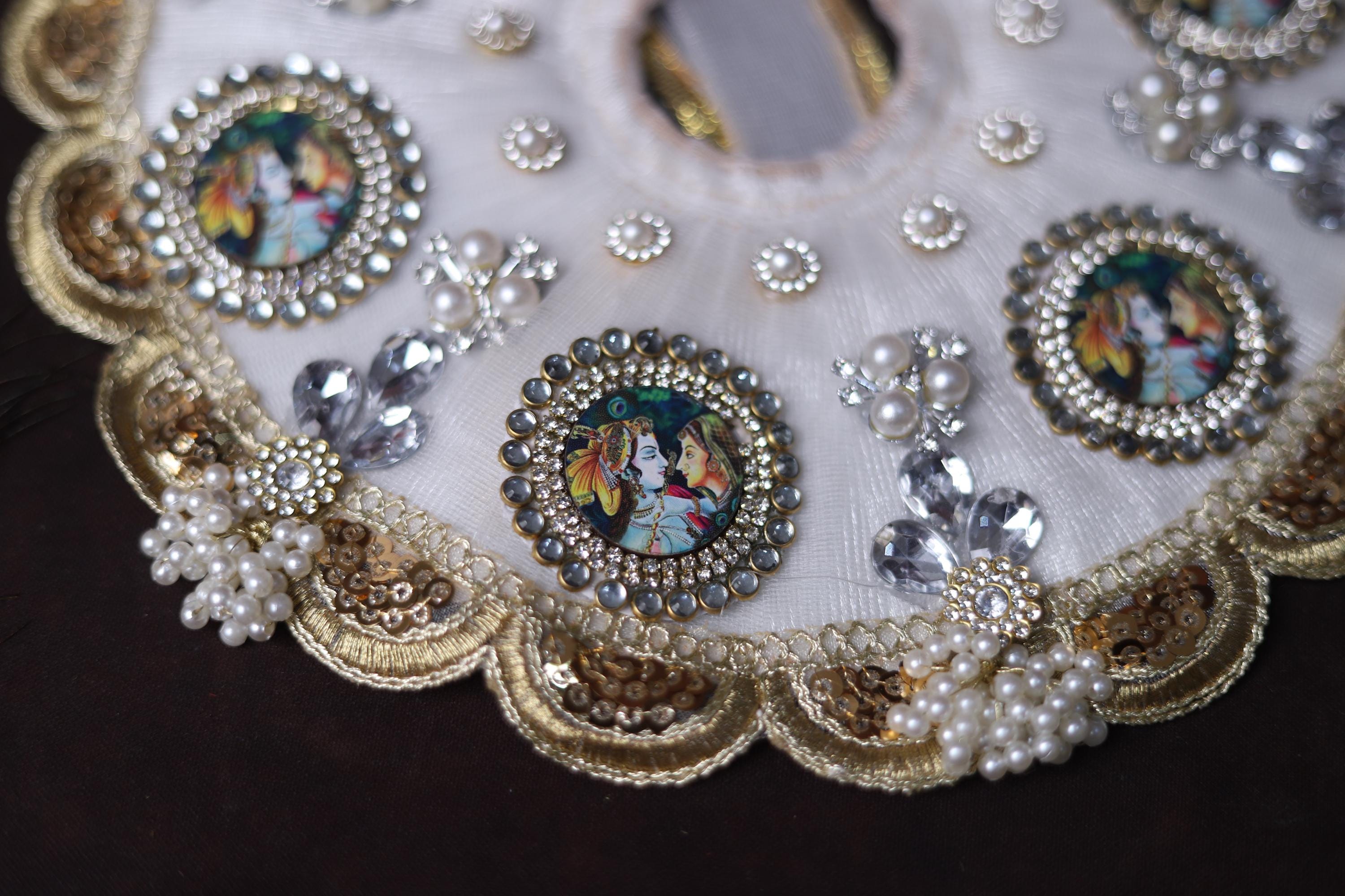 White Shrinathji Embroidered Laddu Gopal Dress with Elegant Golden Ruffled Lace Border Janmashtami and Festive Puja Wear